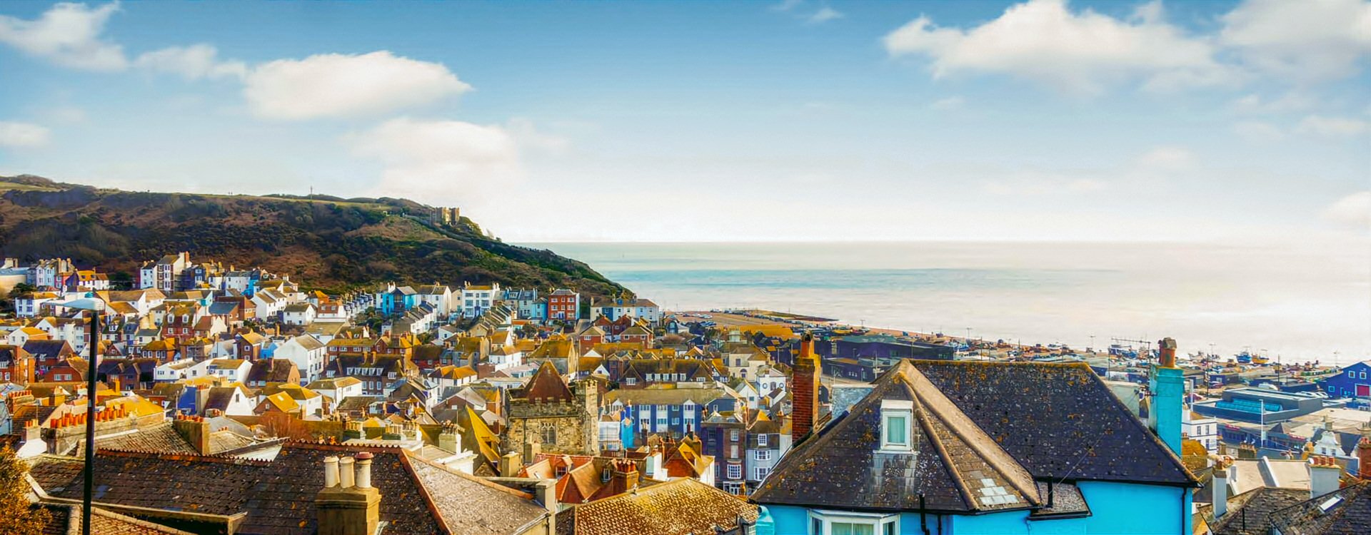 Hastings roof top view Looking over Hastings Old Town roofs from the west hill, showing the East Hill and the sea