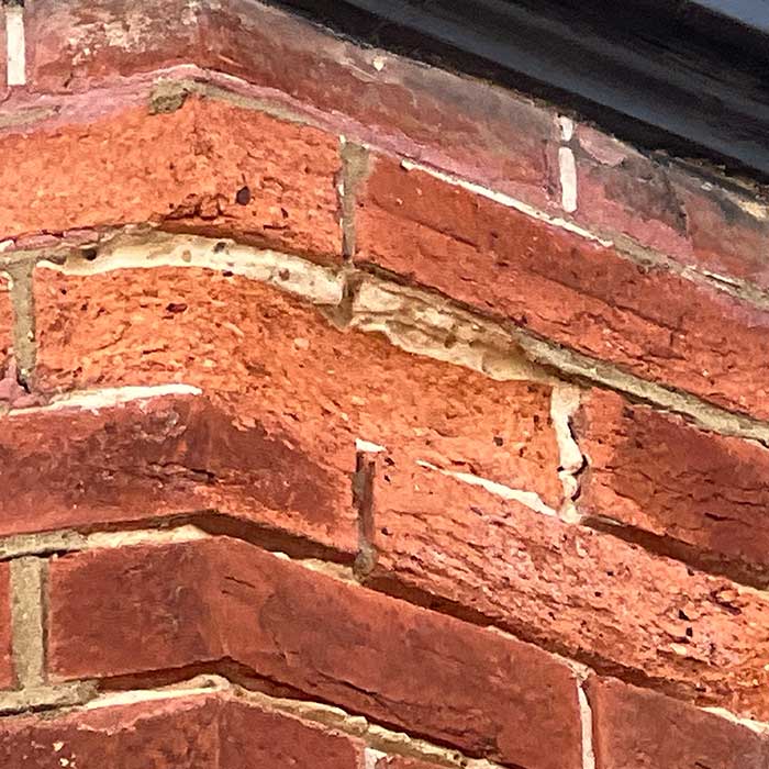 Brick spalling Dampness and defective external finishes inspected during a Hastings period property survey